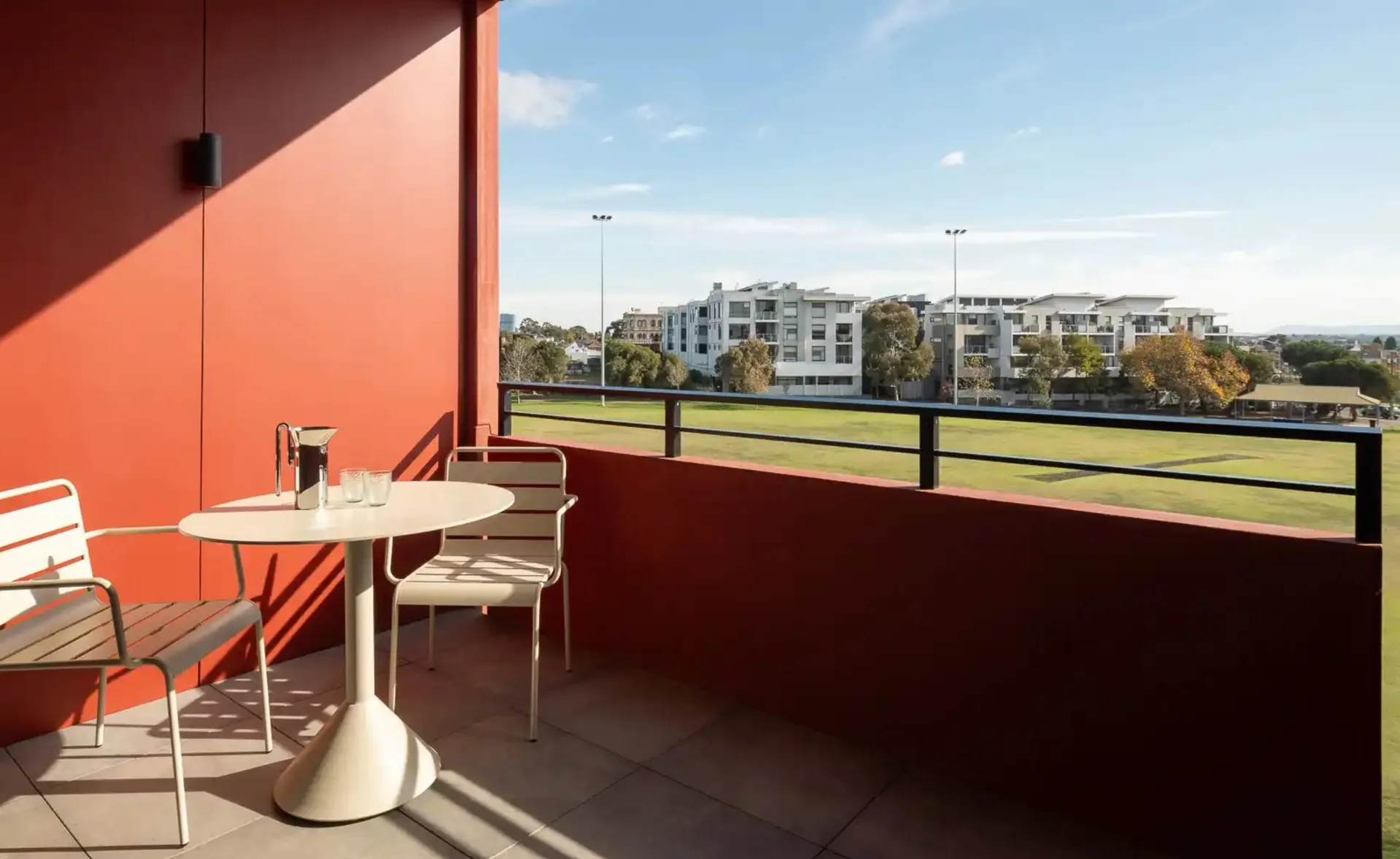 Resident balcony overlooking parkland at LIV Albert, Brunswick